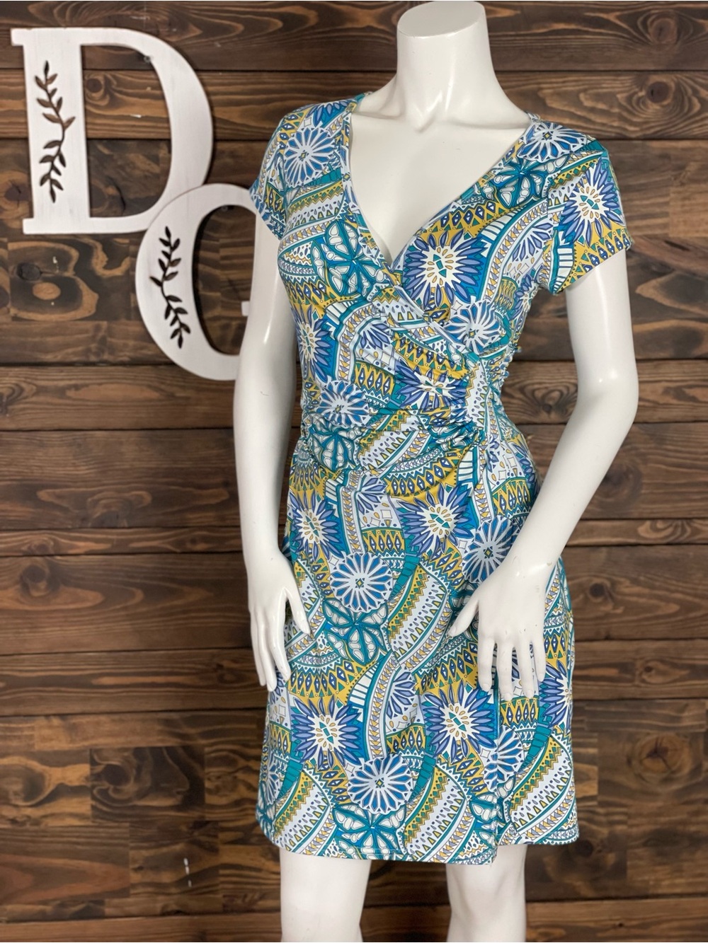 Neesha | Faux Wrap V-Neck Knee Length Dress in Blue & Green Geometric Print
